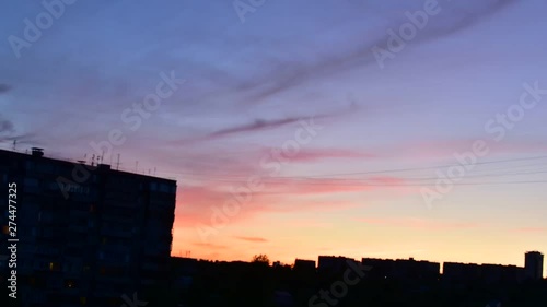 timelapse beautiful sunset in summer on the background of houses in the city