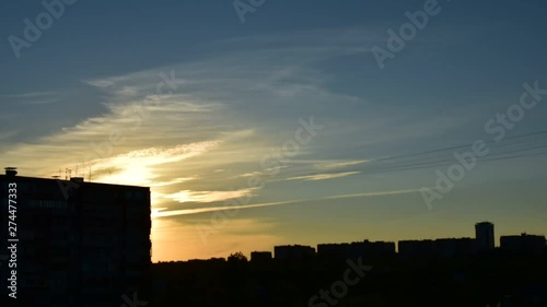 timelapse beautiful sunset in summer on the background of houses in the city
