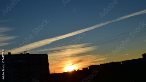 timelapse beautiful sunset in summer on the background of houses in the city