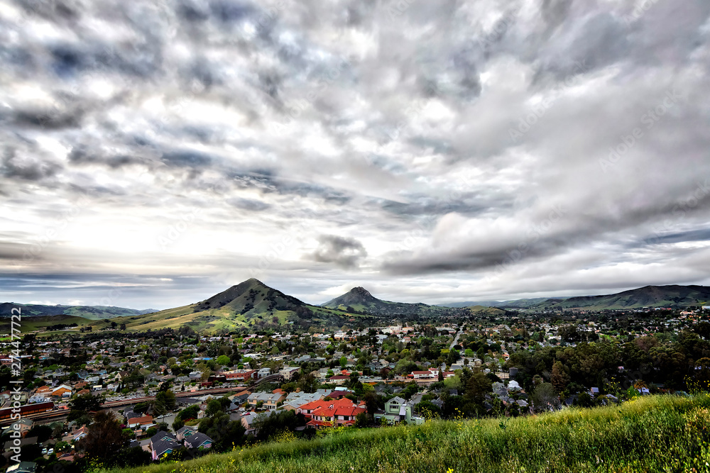 Fototapeta premium Overcast day over Mountains and valley, City