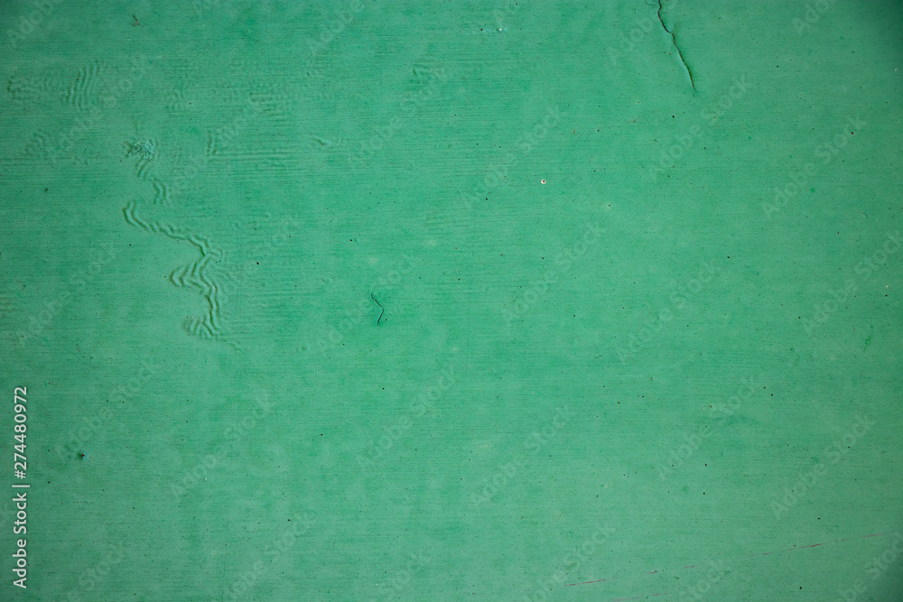 Green painted grunge wall texture background