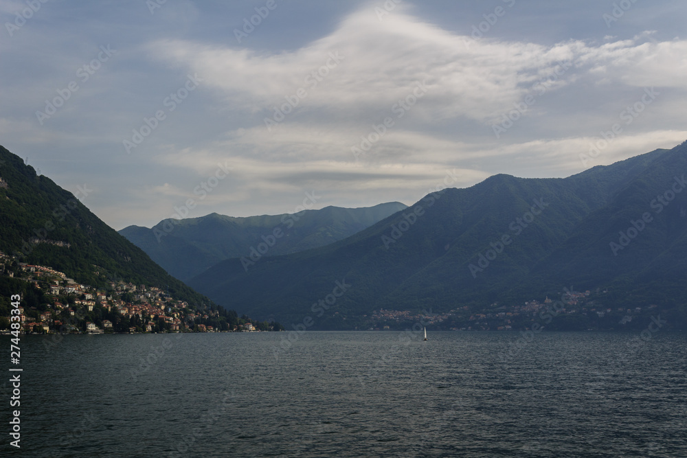 Summer panorama of lake Como. On a background of mountains