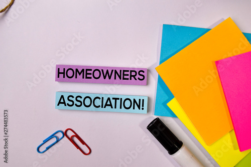 Homeowners Association! on sticky notes isolated on white background.