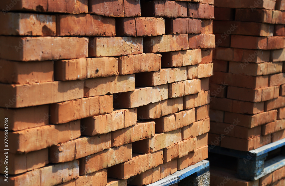 Heap of red bricks on pallet Heap of red bricks on pallet