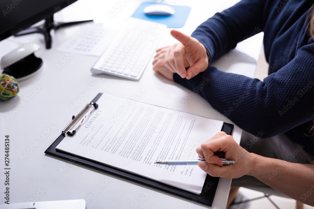 Human's Hand With Contract Agreement Human's Hand With Contract Agreement