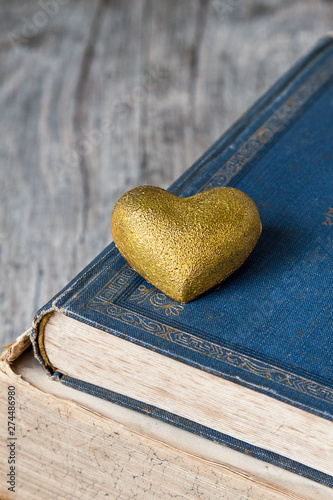 Nostalgic Golden Heart On Old Books photo