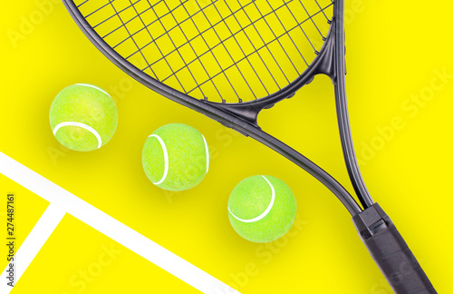 Tennis racket and ball sports on yellow background © Dmytro Flisak