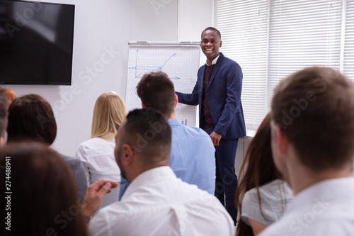 Businessman Giving Presentation To His Colleagues