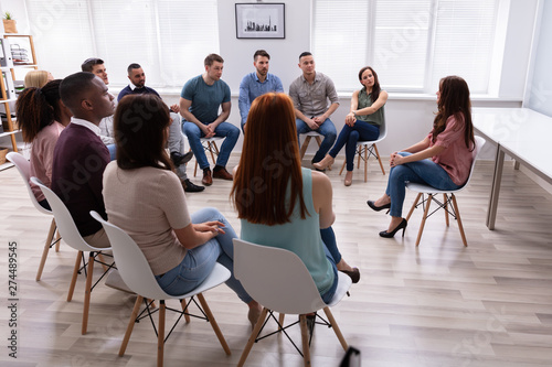 Female Therapist Speaking To Group At Therapy Section photo