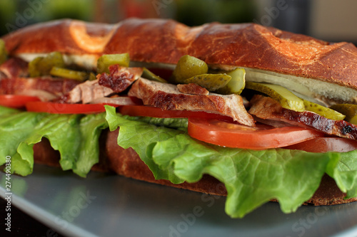 tasty sandwich with pork and vegetables, macro photo close up