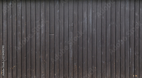 High resolution full frame background of a weathered wood board wall or paneling painted in gray. Copy space.
