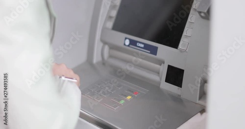 Wallpaper Mural Closeup of woman using an ATM Torontodigital.ca