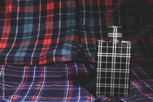 Checked perfume bottle, shirt and trousers