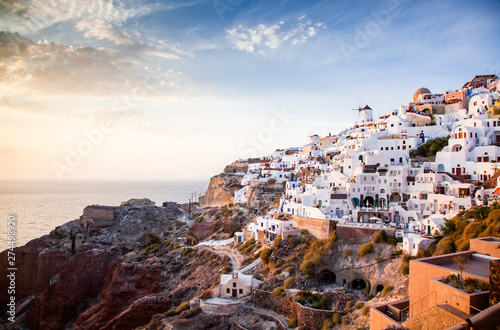 impressive evening view of Santorini island. Picturesque spring sunset on the famous Greek resort Oia, Greece, Europe. Traveling concept background.