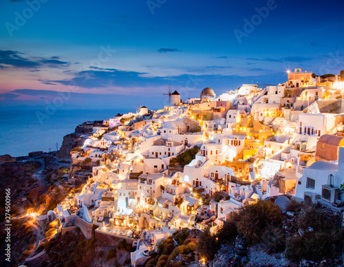 impressive evening view of Santorini island. Picturesque spring sunset on the famous Greek resort Oia, Greece, Europe. Traveling concept background.