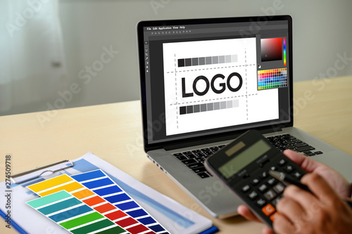 Creative Designer Graphic at work. , Illustrator Graphic designer working digital tablet and computer Color swatch samples
