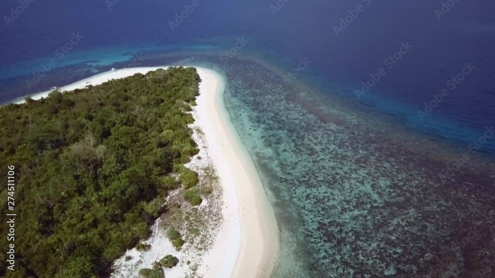 Aerial top view of small tropical island surrounded by turquoise sea. Palawan May 2017. Pedestal movement. Aerial top view of small tropical island surrounded by turquoise sea. Palawan May 2017. Pedestal movement.