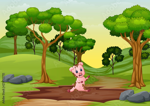 Little pigs playing a mud puddle at road to forest