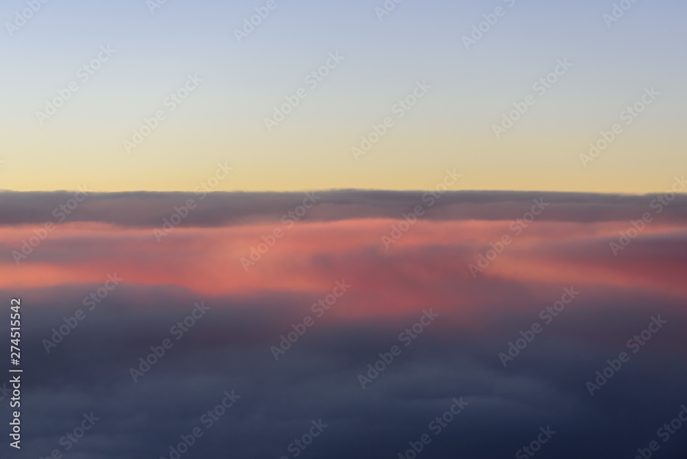The blue skyline with cloudy in sunrise time, view from window on the plane. The blue skyline with cloudy in sunrise time, view from window on the plane.