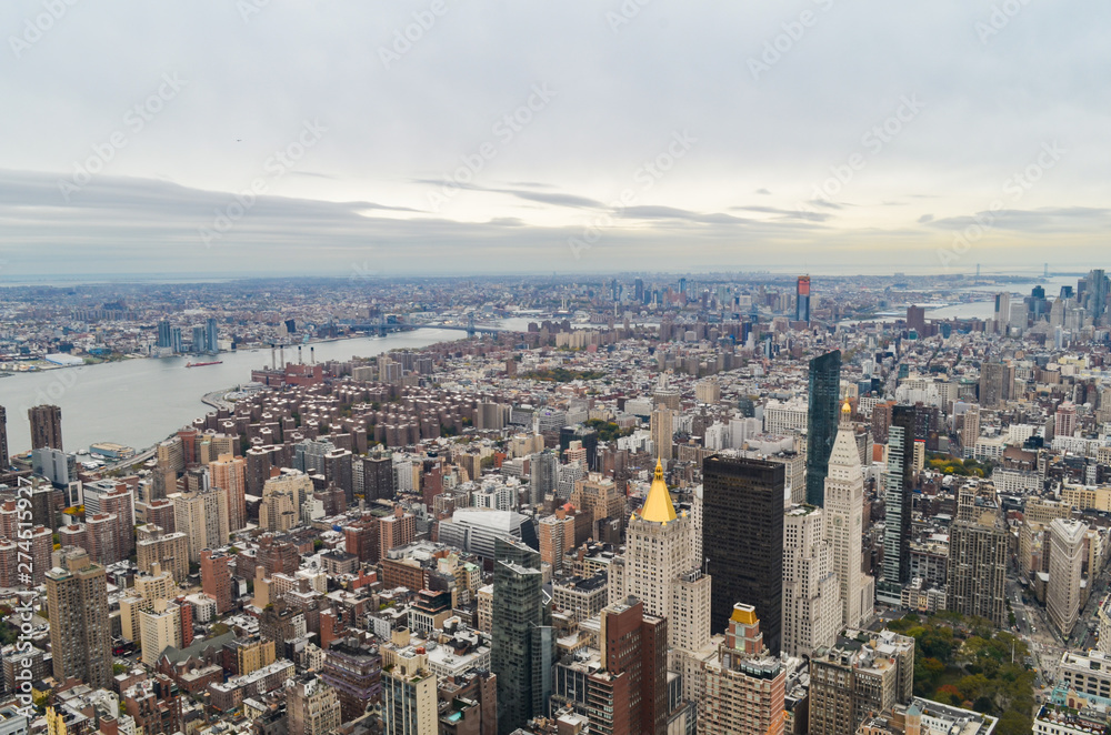 New York City skyscrapers rooftop urban view with sky and cloudy background.