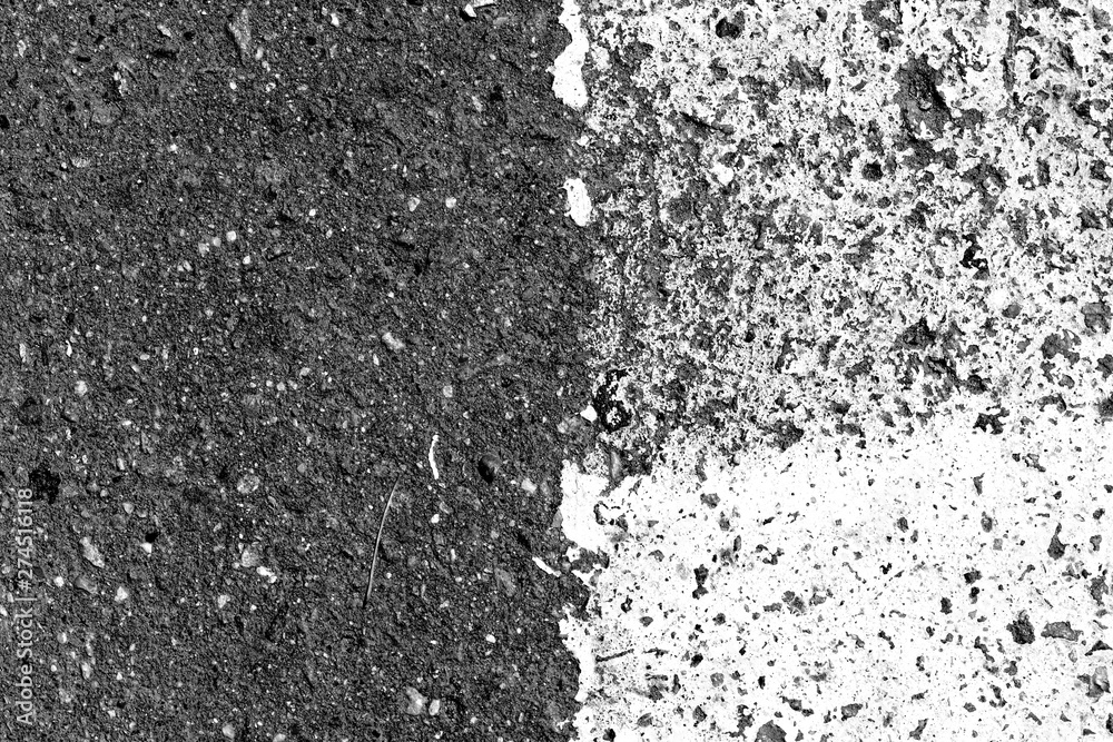 Obraz premium Asphalt surface with old paint on it close up. Abstract background black and white