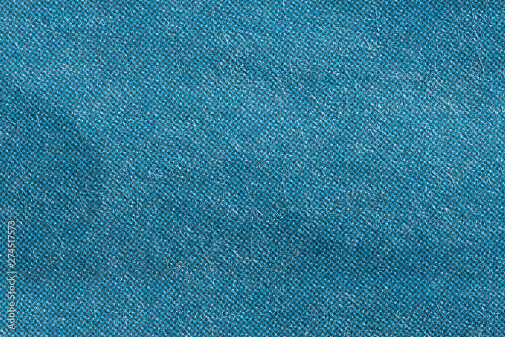 Macro image of blue CMYK dots on newsprint Macro image of blue CMYK dots on newsprint
