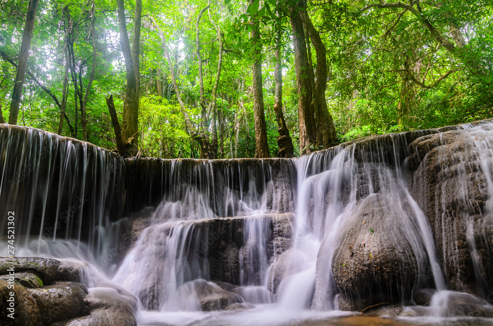 Fototapeta premium Huai Mae Kamin Waterfall in the rainy season at the tropical forest of Kanchanaburi National Park, Thailand