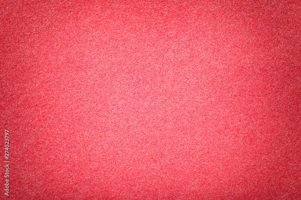 Light red matt suede fabric closeup. Velvet texture of felt. Light red matt suede fabric closeup. Velvet texture of felt.