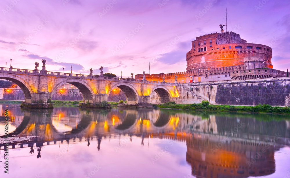 View of the Castel Sant'Angelo and Aelian Bridge in Rome at dusk.