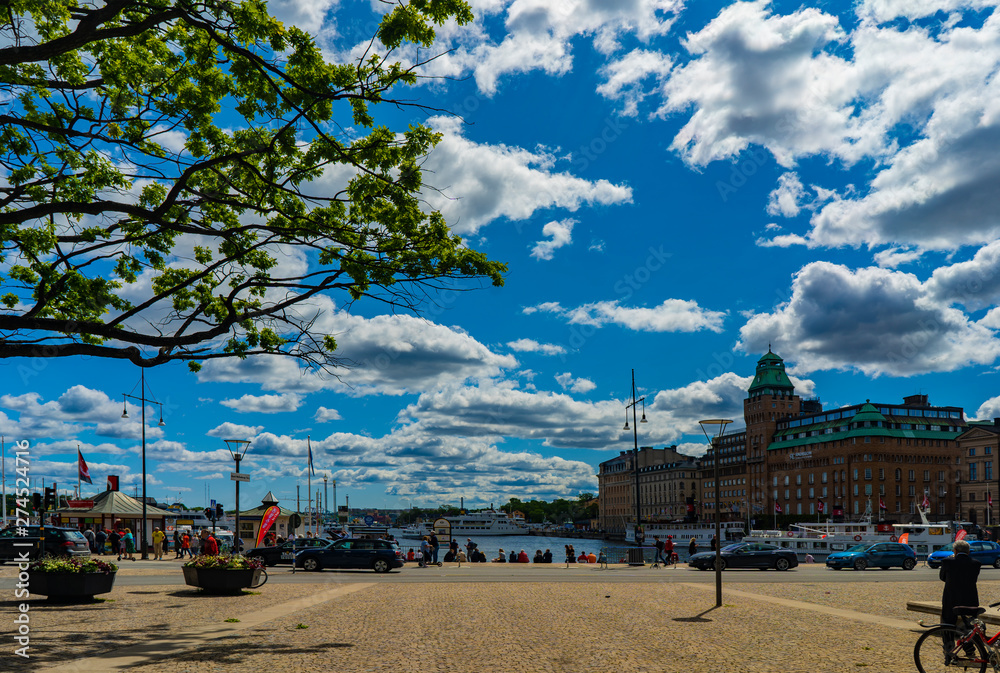 Fototapeta premium Sweden, Stockholm, Norrmalm, Nybrohamnen, Sunny embankment