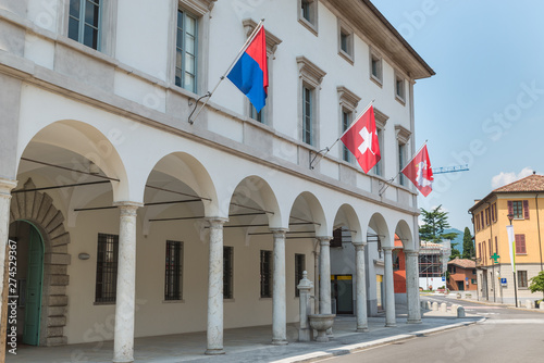 Historic center of Riva San Vitale with the town hall, Switzerland. Tourist town on Lake Lugano at the foot of Monte San Giorgio, UNESCO site for the important fossiliferous deposits