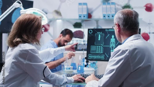 Team of scientists working in advanced busy laboratory