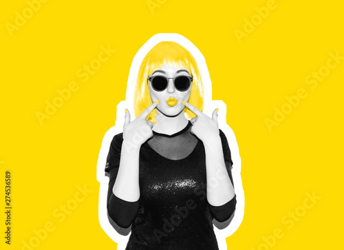 Fototapeta Acid crazy beautiful rock. A girl in a bright pink wig and sunglasses. Dangerous rock party is boring, a woman ironically having fun. Flash style on a colored background. Exclusive