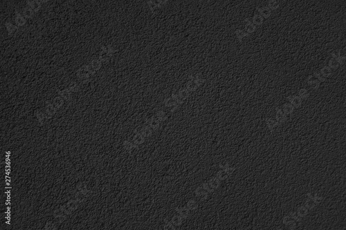 Black wall background texture. Perfect copy space. Blank empty stucoo material for project backdrop.