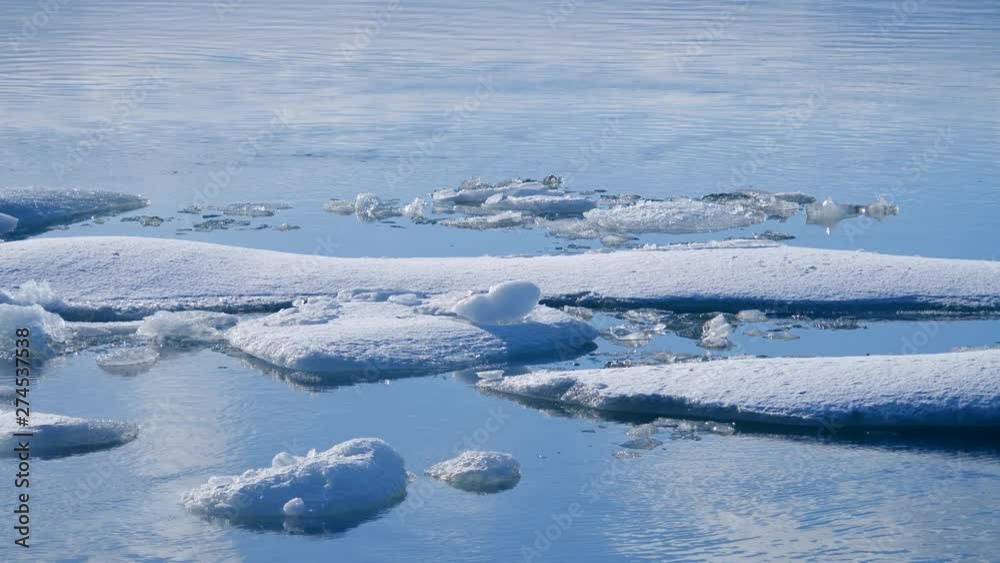 Ocean waves washed icebergs. Global warming problem Ocean waves washed icebergs. Global warming problem