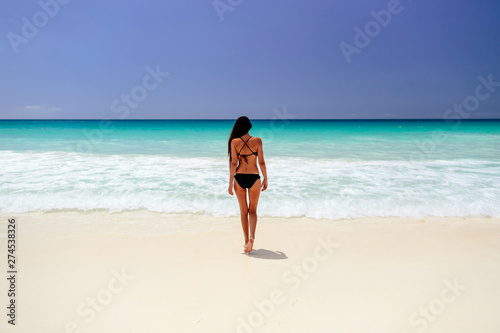 woman on beach vacation in tropics © shevtsovy