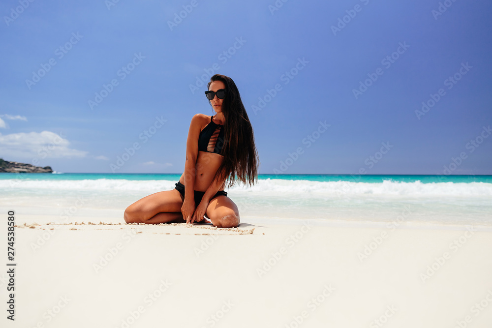 woman on beach vacation in tropics