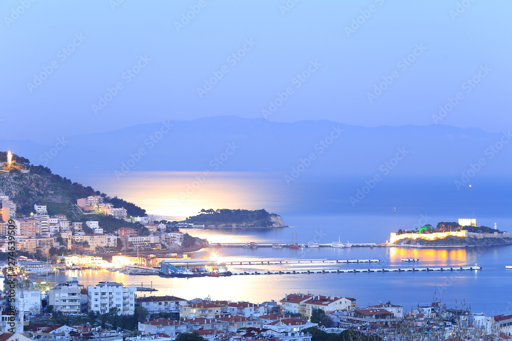 view of moonnight at harbour in turkey with blue sky befor sunrise