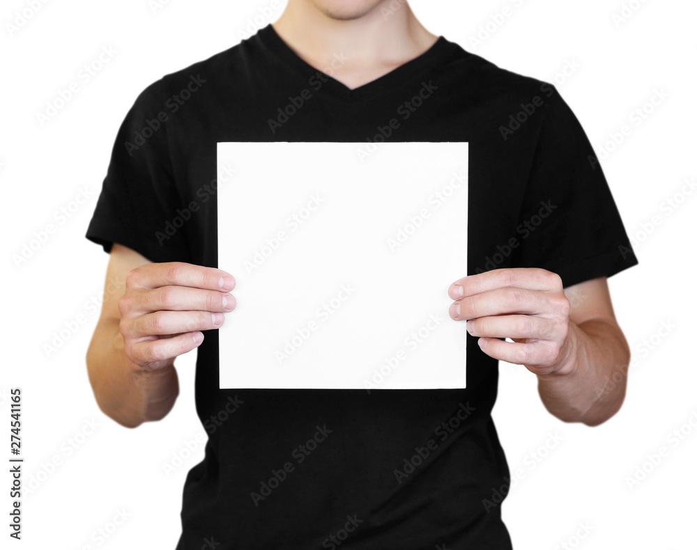 A man holding a white sheet of paper. Holding a booklet. Close up. Isolated on white background A man holding a white sheet of paper. Holding a booklet. Close up. Isolated on white background