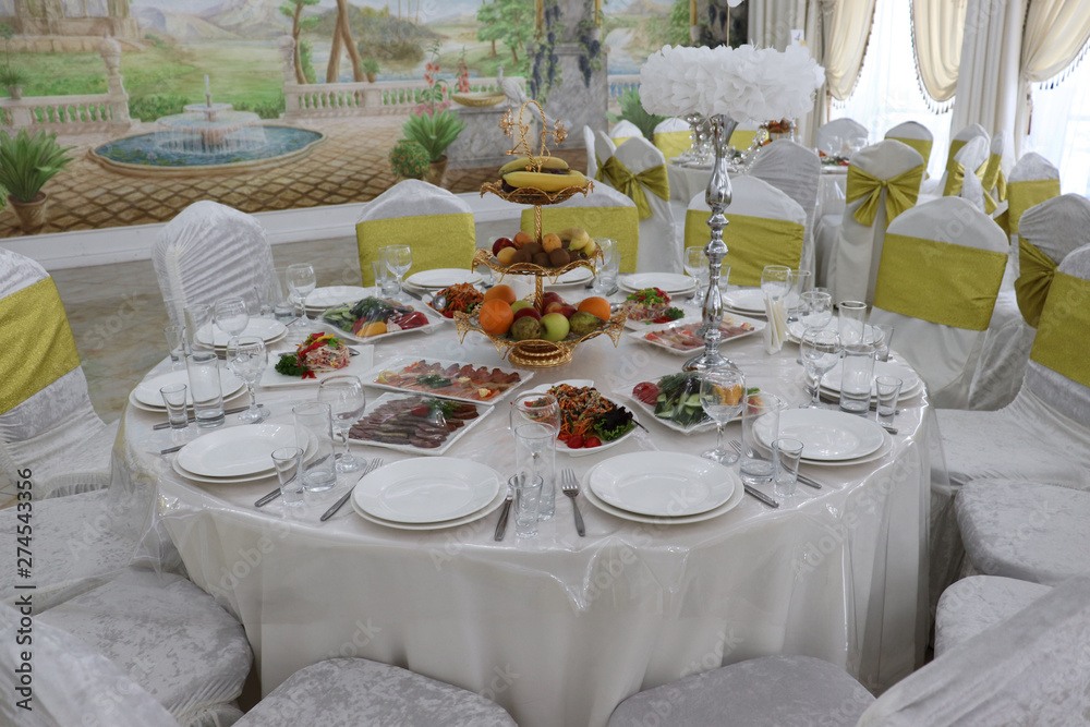 Wedding dinner table with plates of food