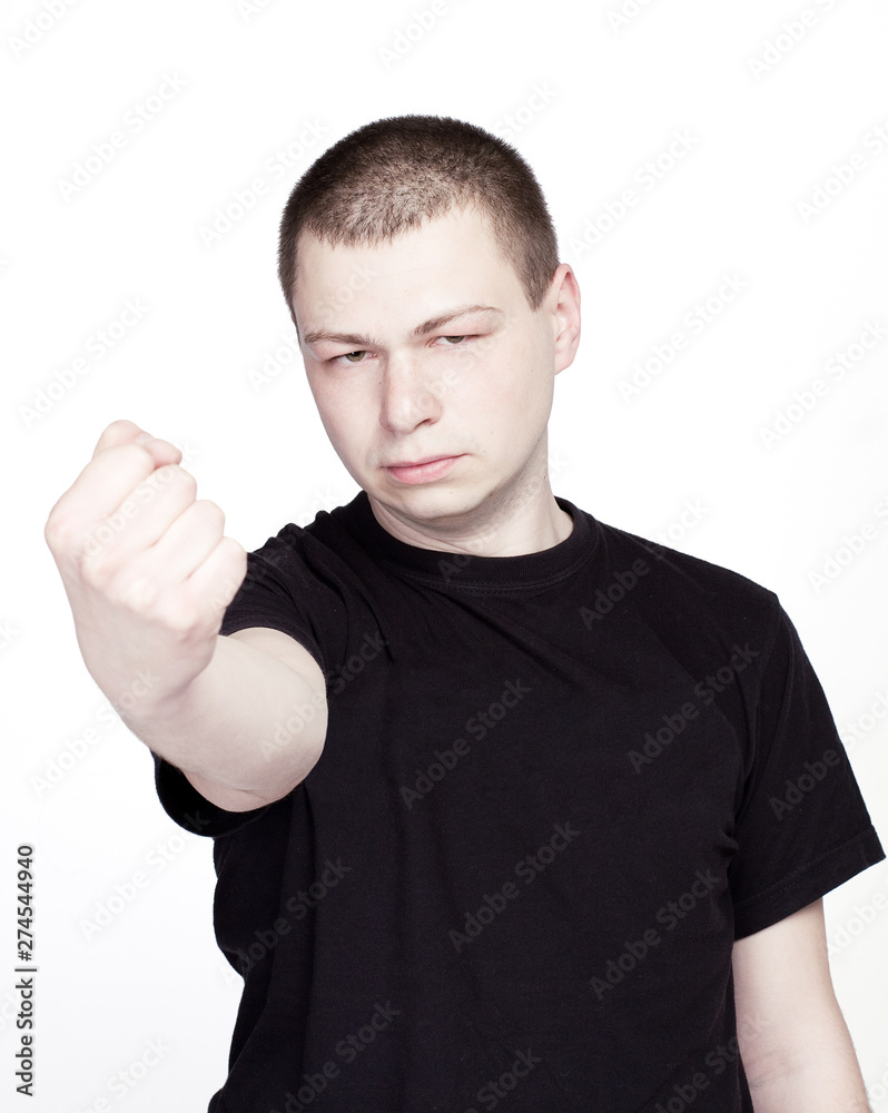 Young hoolign Man show the Fist. On white Background Young hoolign Man show the Fist. On white Background