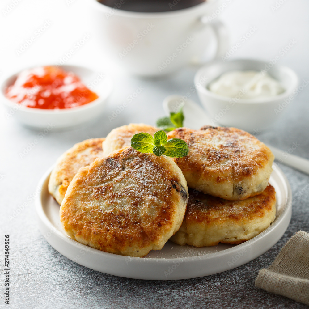 Homemade cottage cheese pancakes on white plate