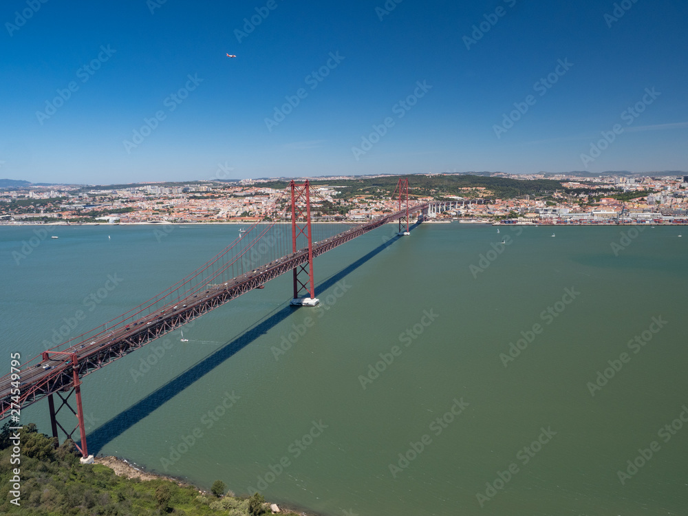 Portugal, may 2019: The 25 April bridge (Ponte 25 de Abril) is a steel suspension bridge located in Lisbon, crossing the Targus river. It is one of the most famous landmarks of the region.