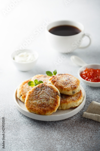 Homemade cottage cheese pancakes on white plate