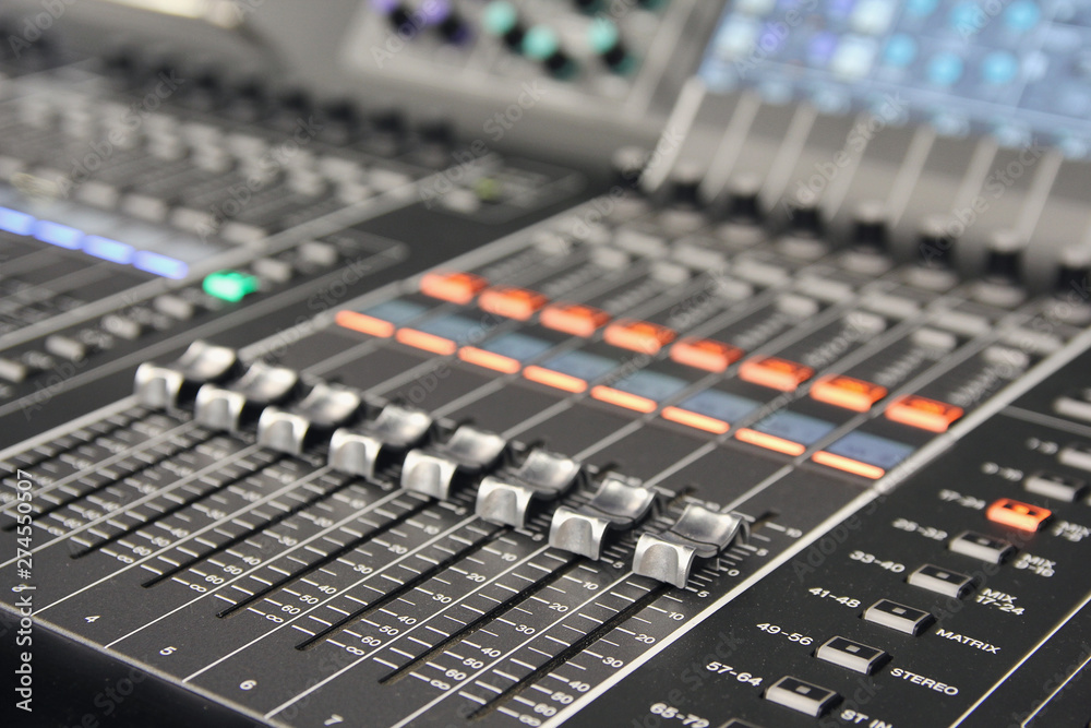 Professional audio mixing console closeup. Music studio