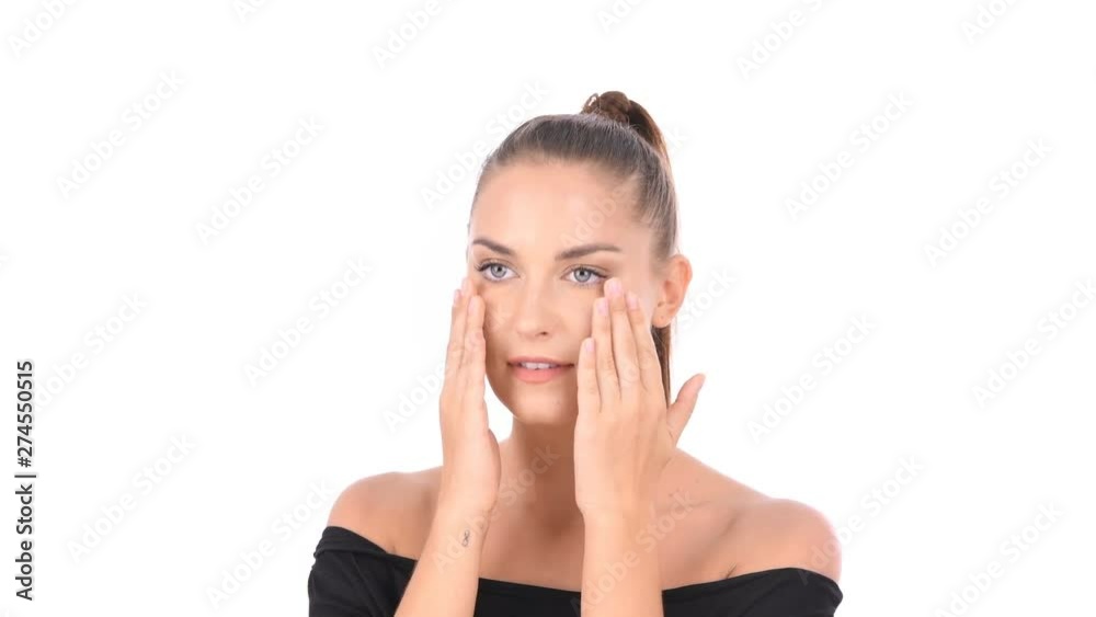 Beauty concept. Women are fondling on her face on a white background. Beauty concept. Women are fondling on her face on a white background.