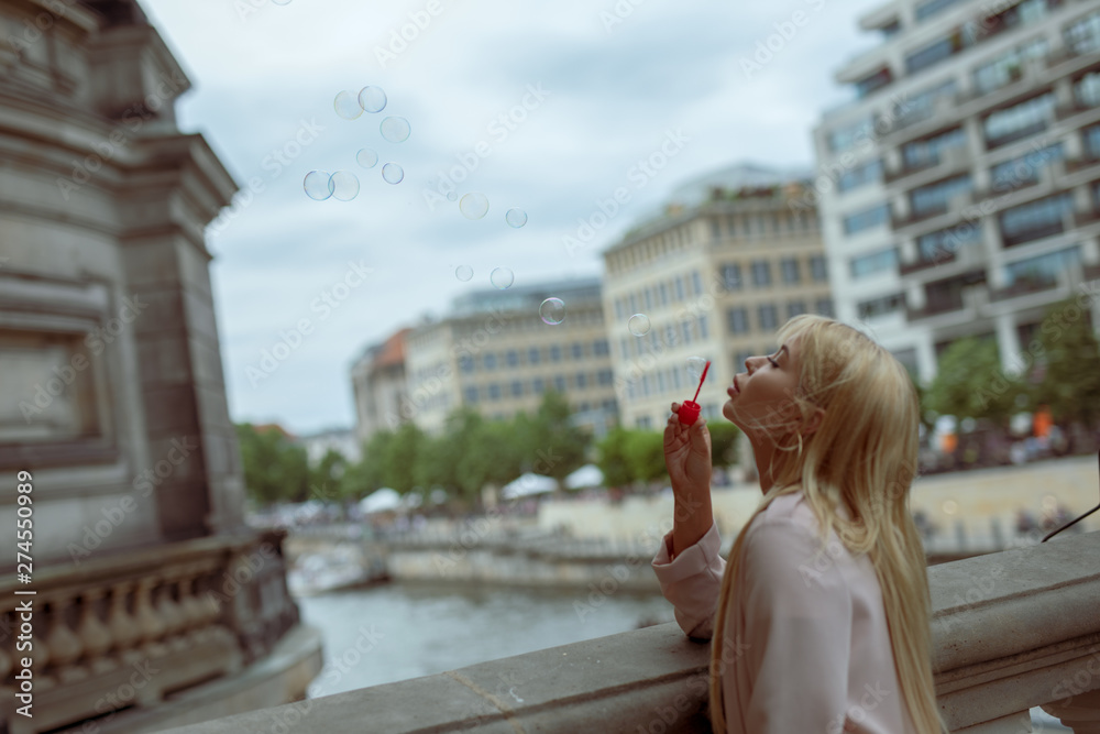 Fototapeta premium Woman in rush on a hall of city