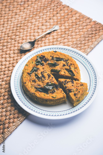 Handvo/handwa is a vegetable cake originating from the Gujarat, India. selective focus photo