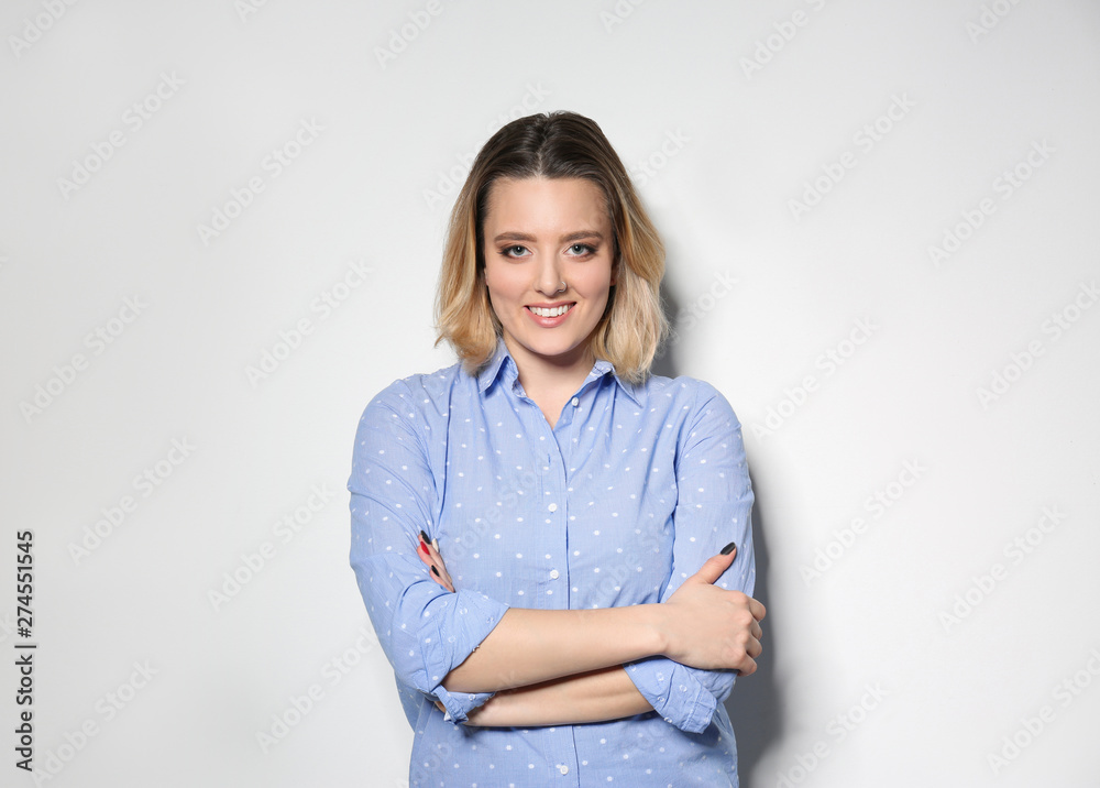Portrait of attractive woman on light background Portrait of attractive woman on light background