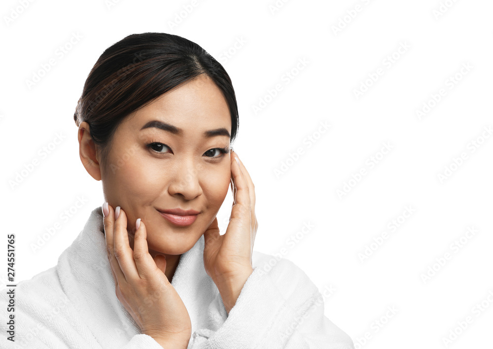 Portrait of beautiful Asian woman in bathrobe isolated on white. Spa treatment Portrait of beautiful Asian woman in bathrobe isolated on white. Spa treatment